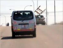  ??  ?? A commuter omnibus carries a ladder in dangerous fashion as the ladder can be a hazard to other motorists who are overtaking. The picture was taken on Friday along Luveve road