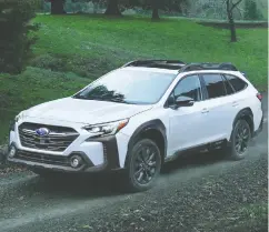  ?? SUBARU ?? Changes to the Outback include a stretched honeycomb
grill and headlights that look more shapely and avian.