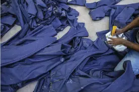  ?? ?? A jean factory in Ballari, Karnataka. One garment worker said she only earned about half of what she needed to cover basic living costs, such as food and rent. Photograph: Bloomberg/ Getty