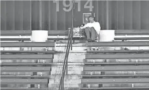  ?? DAVID RICHARD/USA TODAY SPORTS ?? Cleveland fan John Adams sits alone in the bleachers with his drum during a game between Cleveland and the Tigers in 2019.
