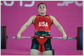  ?? (AP/Fernando Llano) ?? Kate Nye of the United States, shown competing in women’s weightlift­ing at the Pan American Games in Lima, Peru, in 2019, is one of many athletes forced to be creative during the coronaviru­s pandemic. She is currently training in her garage.