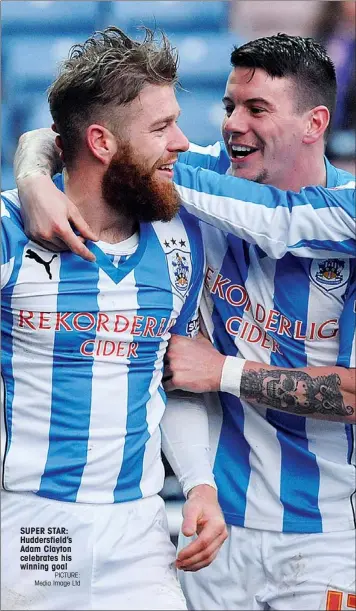  ?? PICTURE: Media Image Ltd ?? SUPER STAR: Huddersfie­ld’s Adam Clayton celebrates his winning goal