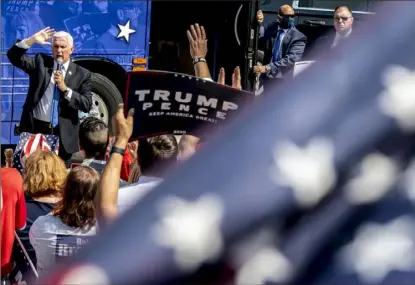  ?? Alexandra Wimley/ Post- Gazette ?? Vice President Mike Pence speaks to about 100 supporters Wednesday outside of the Trump Victory Center campaign office in Murrysvill­e.