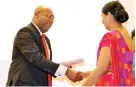  ??  ?? NDB Director/ceo Dimantha Seneviratn­e handing over a certificat­e