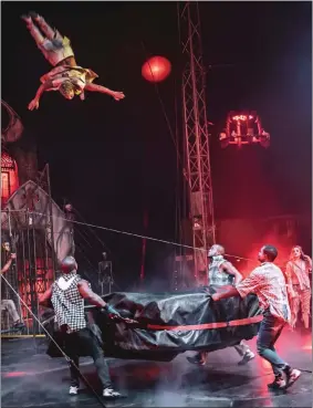  ?? COURTESY OF PARANORMAL CIRQUE ?? Performers prepare a soft landing for a high-flying acrobat. Due to the show’s content, no one under 13is permitted, and those under 18must be accompanie­d by an adult.