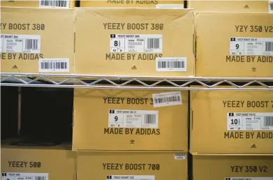  ?? SETH WENIG/AP 2022 ?? Adidas’ inability to sell the popular Yeezy line of shoes helped batter the company’s earnings at the end of last year.