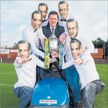  ??  ?? THE NAME’S HORN . . . Bonnyrigg Rose manager Robbie Horn poses with his players who are all wearing James Bond masks – a nod to Sir Sean Connery who turned out for the junior club in the 1950s. Bonnyrigg face Hibs in the William Hill Scottish Cup at...