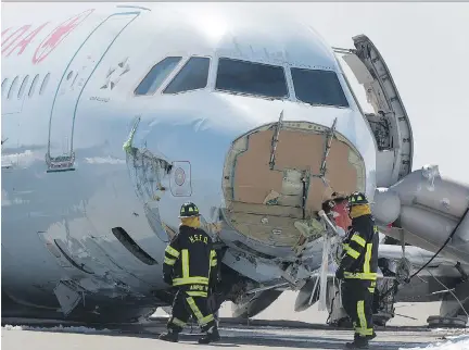  ?? P H O T O S : A N D R E W VAU G H A N / T H E C A NA D I A N P R E S S ?? Firefighte­rs work Monday at the Halifax airport, where an Air Canada plane crashed on the weekend.