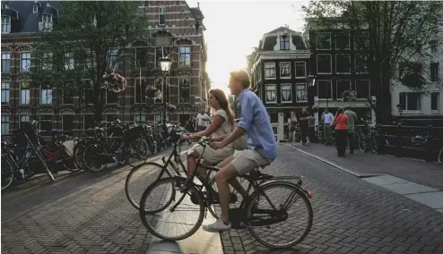  ?? ?? Amsterdam est, sans surprise, l'une des villes les plus populaires pour les cyclistes