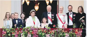  ?? HAAKON MOSVOLD LARSEN/AFP/GETTY IMAGES ?? Left to right: Leah Isadora Behn, Princess Ingrid Alexandra, Prince Sverre Magnus, Maud Angelica Behn, Queen Sonja, Emma Tallulah Behn, King Harald, Crown Princess Mette-Marit, Crown Prince Haakon and Martha greet wellwisher­s from the balcony of the...
