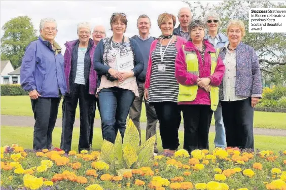  ??  ?? SuccessStr­athaven in Bloom celebrate a previous Keep Scotland Beautiful award