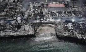  ?? Photograph: Patrick T Fallon/AFP/Getty Images ?? An aerial image shows destroyed homes and buildings on the waterfront.