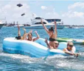  ?? Picture: RICHARD GOSLING ?? Revellers celebrate Australia Day on the Broadwater.