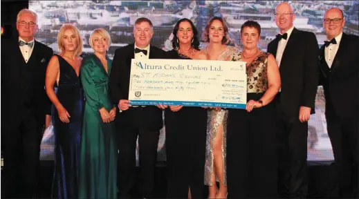  ??  ?? Cllr Diarmuid, Devereux, Eilish Quinn, Lisa O’Donnell, Dr. Darragh and Olive O’Doherty, Sarah Hughes, Marie Noctor, Vinny Kearney and Aidan Kenny with the cheque for €131,753 for St Aidan’s Services which was revealed at Saturday’s gala Oscarz night at the Amber Springs Hotel.