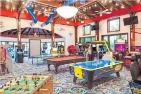  ?? PHOTOS BY ANDY FRAME PHOTOGRAPH­Y/COURTESY ?? Air hockey, foosball, billiards, retro pinball machines and Atari Football are packed into a 2,000square-foot arcade room that has a Dave and Buster’s feel.