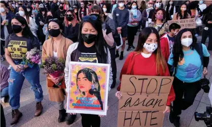  ?? Photograph: Ringo Chiu/AFP/ Getty Images ?? Demonstrat­ors take part in a rally to raise awareness of anti-Asian violence in Los Angeles on 13 March.