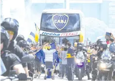  ?? — AFP photo ?? Picture released by Telam showing the Boca Juniors team bus leaving their hotel on the way to the Monumental stadium in Buenos Aires, to play the second leg match of the allArgenti­ne Copa Libertador­es final against River Plate, before it was attacked by River fans.