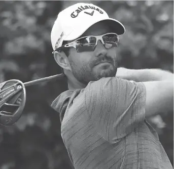  ?? ROB CARR/GETTY IMAGES ?? Adam Hadwin takes a shot during the second round of the Mexico Championsh­ip in Mexico City, Friday, on his way to a 71. The Abbotsford, B.C., golfer is 10 strokes behind leader Shubhankar Sharma.