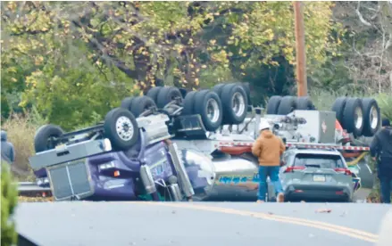  ?? RICH ROLEN/SPECIAL TO THE MORNING CALL ?? A fuel truck overturned early Thursday morning near Paul Avenue and West Union Boulevard in Bethlehem, spilling thousands of gallons of fuel and prompting the evacuation of hundreds of residents.