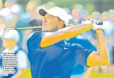  ?? ASSOCIATED PRESS ?? Tiger Woods watches a shot on the 15th hole during the third round of the PGA Championsh­ip golf tournament at Bellerive Country Club.