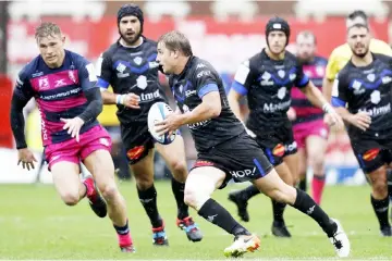  ??  ?? Castres’ French centre Florian Vialelle makes a break during the European Rugby Champions Cup pool 2 rugby union match between Gloucester and Castres at Kingsholm Stadium in Gloucester, western England. — AFP photo