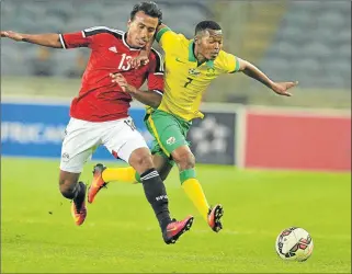  ?? Picture: GALLO IMAGES ?? FLUENCY FACTOR: Mohamed Abdel-Shafy, left, of Egypt and Mandla Masango of South Africa during the 2016 Nelson Mandela Challenge match at Orlando Stadium in Johannesbu­rg. SuperSport United coach Stuart Baxter wants Masango to add some spark to his team...