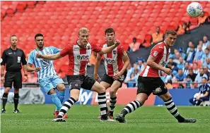  ?? ?? Jordan Willis fires home the Sky Blues’ first goal in the 2018 play-off final