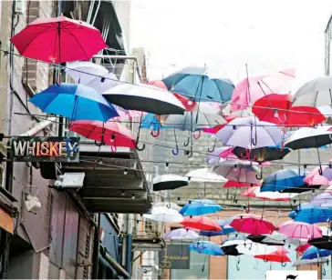  ??  ?? 7 You can’t miss the whimsical umbrellas as you stroll to Zozimus Bar.