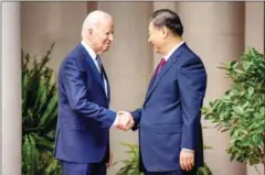  ?? THE WHITE HOUSE ?? US President Joe Biden shakes hands with Chinese President Xi Jinping during their recent summit on November 15.