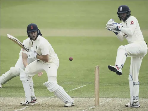  ??  ?? 0 Batsman James Bracey flicks the ball away as wicketkeep­er Ben Foakes watches from behind the stumps at the Ageas Bowl.