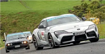  ?? JOHN COWPLAND/ ALPHAPIX ?? A Toyota GR Supra leads a BMW. Not that we mean anything by that.