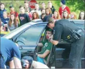  ?? LEAH MCDONALD - ONEIDA DAILY DISPATCH ?? First responders and student actors take part in a mock DWI accident on Friday, May 19, 2017, at VernonVero­naSherrill High School.