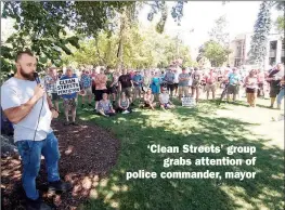  ?? JOE FRIES/Okanagan Newspaper Group ?? ‘Clean Streets’ group grabs attention of police commander, mayor Jason Reynan, one of the leaders of Clean Streets Penticton, speaks to a wellattend­ed rally Tuesday in Gyro Park.