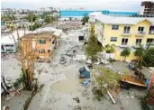  ?? DOUGLAS R. CLIFFORD/TAMPA BAY TIMES/AP ?? Homes lay in ruin on Fort Myers Beach, which was mostly destroyed after Hurricane Ian made landfall overnight on Wednesday.