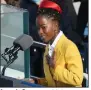  ?? (The New York Times/Erin Schaff) ?? Amanda Gorman, at 22 the youngest inaugural poet in U.S. history, recites her poem Wednesday. First lady Jill Biden had heard her at the Library of Congress and suggested her to organizers.