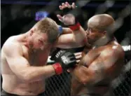  ?? JOHN LOCHER — THE ASSOCIATED PRESS ?? Daniel Cormier, right, fights Stipe Miocic during a heavyweigh­t title mixed martial arts bout at UFC 226, Saturday in Las Vegas.