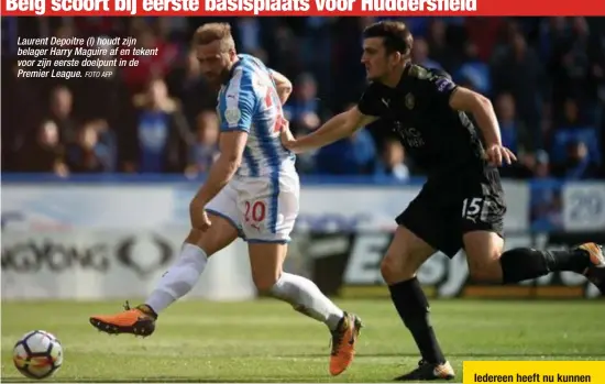  ?? FOTO AFP ?? Laurent Depoitre (l) houdt zijn belager Harry Maguire af en tekent voor zijn eerste doelpunt in de Premier League.