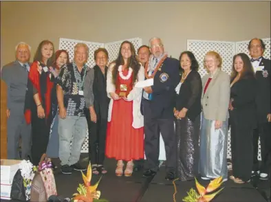  ?? Courtesy photo ?? Jennifer Karaca (center red) is recognized as District 50 Hawai‘i Lions Humanitari­an of the Year on April 27 in Honolulu.
