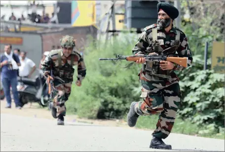  ?? Picture: EPA ?? READY FOR ACTION: Indian Army soldiers run to take up positions as exchanges of fire continued with militants holed up in the police station at Dinanagar in Gurdaspur, India, yesterday. Gunmen disguised in India military fatigues attacked a police...