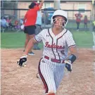  ?? ?? Baldwin’s Chloe Gotto races home to score in the Gateway Conference high school softball final against Paxon.