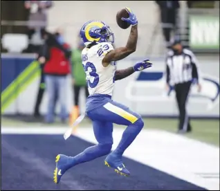  ?? Associated Press ?? PLAYOFF DEBUT — Los Angeles Rams running back Cam Akers reacts after scoring on a 5-yard run against the Seattle Seahawks during the first half of an NFL wild-card playoff game on Saturday in Seattle.