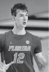  ?? JOHN AMIS/AP ?? Florida forward Colin Castleton has bolstered the Gators’ beleaguere­d inside game after transferri­ng from Michigan this season.