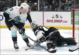  ?? MARK J. TERRILL — THE ASSOCIATED PRESS ?? Kings goalie Cal Petersen sprawls to make a save on Seattle’s Ryan Donato on Tuesday.