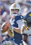  ?? STAFF PHOTO BY MATT HAMILTON ?? UTC’s Chase Artopoeus looks for a receiver during Saturday’s home game against ETSU.