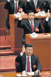  ?? Picture: AFP ?? NEW ERA: Chinese President Xi Jinping raises his hand to vote for the reports with other China's leaders at the closing of the 19th Communist Party Congress in Beijing yesterday