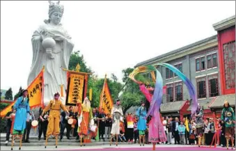  ?? HU LINGYUN / FOR CHINA DAILY ?? Artists perform on stilts during a tourism festival celebratin­g the Mazu culture in Tianjin on Thursday. A worship rite for a sea goddess in China’s vast eastern and southern coastal areas, and widely practiced throughout Southeast Asia, the Mazu ritual is now a gathering that highlights various folk arts.