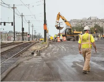  ?? STAFF PHOTO, TOP, BY PATRICK WHITTEMORE, ABOVE, BY MARK GARFINKEL ?? HEADACHE INDUCING: Commuters are being warned to avoid both the Mass Pike, top, and the Green B line, above, during the constructi­on project due to closures.