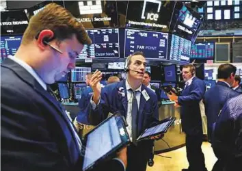  ?? Reuters ?? Traders at the New York Stock Exchange. Market jitters are expected after the US president said he will push ahead with tariffs on $50 billion worth of Chinese goods.