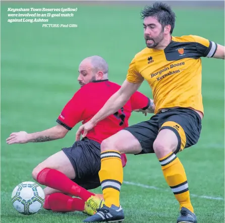  ?? PICTURE: Paul Gillis ?? Keynsham Town Reserves (yellow) were involved in an 11-goal match against Long Ashton