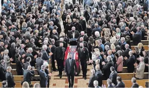  ?? PAUL CHIASSON THE CANADIAN PRESS ?? Pallbearer­s carry the casket of former Montreal Canadiens hockey player Guy Lafleur, following the funeral service in Montreal on Tuesday.